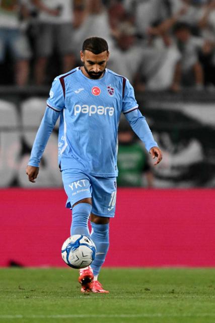 Trabzonspor's Egyptian forward #10 Mohamed Salah kicks the ball after Ferencvaros' opening goal during the UEFA Europa League second leg playoff football match between   Ferencvaros and Trabzonspor in Budapest on August 27, 2026. (Photo by Attila KISBENEDEK / AFP)