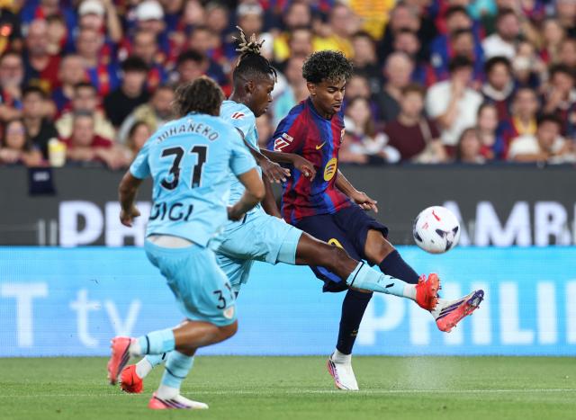 Barcelona's Spanish forward #10 Lamine Yamal fights for the ball with Athletic Bilbao's Spanish forward #10 Nico Williams during the Spanish league football match between FC Barcelona and Athletic Club Bilbao at Camp Nou Stadium in Barcelona on August 27, 2026. (Photo by Josep LAGO / AFP)