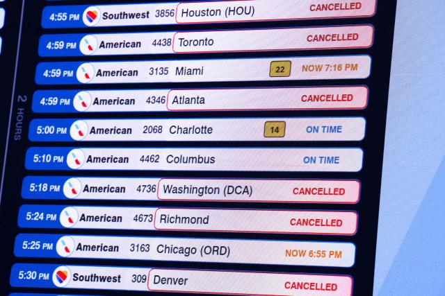 A flight information display board shows several flights cancelled at LaGuardia Airport in Queens, New York on August 27, 2026. Flight traffic at various New York area airports has been disrupted due to the weather, according to the FAA. (Photo by CHARLY TRIBALLEAU / AFP)