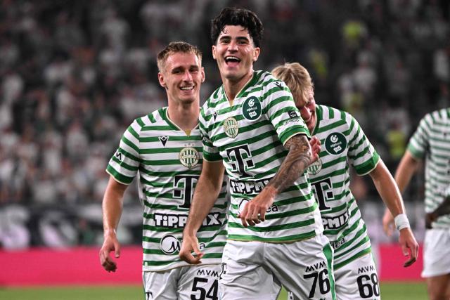 Ferencvaros' Hungarian forward #76 Krisztian Lisztes (C) celebrates scoring his team's fourth goal with Ferencvaros' Hungarian defender #54 Oliver Nagy and Ferencvaros' Hungarian forward #68 Zeteny Varga (R) during the UEFA Europa League second leg playoff football match between Ferencvaros and Trabzonspor in Budapest on August 27, 2026. (Photo by Attila KISBENEDEK / AFP)