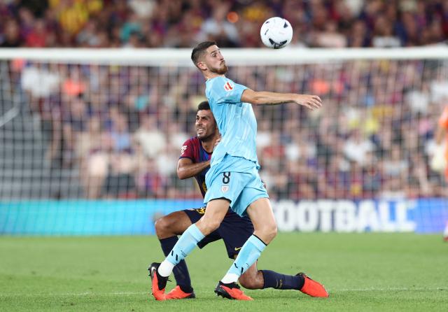 Barcelona's Spanish midfielder #16 Rodri fights for the ball with Athletic Bilbao's Spanish midfielder #08 Oihan Sancet during the Spanish league football match between FC Barcelona and Athletic Club Bilbao at Camp Nou Stadium in Barcelona on August 27, 2026. (Photo by Josep LAGO / AFP)