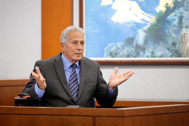 Former Las Vegas Metro Police Sergeant Stan Hyt testifies in court during the Duane Davis murder trial, related to the 1996 killing of rapper Tupac Shakur, in Clark County District Court at the Regional Justice Center in Las Vegas, Nevada, on August 27, 2026. The trial of the former gang leader accused of orchestrating the murder of rapper Tupac Shakur began on August 10, 30 years after one of America's most high-profile unresolved killings. The proceedings, expected to last a month, will likely not make clear who fired the shots that killed the California hip-hop legend on the night of September 7, 1996, while he was in Las Vegas to see a Mike Tyson boxing match. (Photo by Steve Marcus / POOL / AFP)