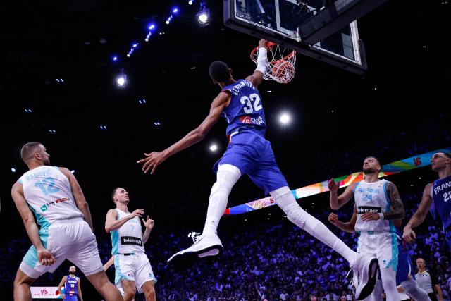 France's #32 Victor Wembanyama dunks the ball during the FIBA Basketball World Cup 2027 European Qualifier game between France and Slovenia at the Palais Omnisports de Paris-Bercy, in Paris on August 27, 2026. (Photo by Simon WOHLFAHRT / AFP)
