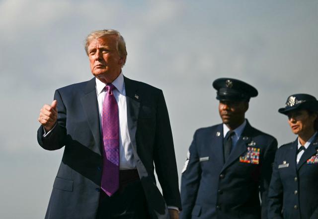 US President Donald Trump gives a thumbs up after stepping off Air Force One upon arrrival at Ellington Airport in Houston, Texas, on August 27, 2026. Trump is in Houston to headline a Republican National Committee (RNC) fundraiser to boost Ken Paxton's US Senate campaign. (Photo by Kent NISHIMURA / AFP)