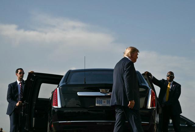 US President Donald Trump walks to enter his limousine upon arrival at Ellington Airport in Houston, Texas, on August 27, 2026. Trump is in Houston to headline a Republican National Committee (RNC) fundraiser to boost Ken Paxton's US Senate campaign. (Photo by Kent NISHIMURA / AFP)