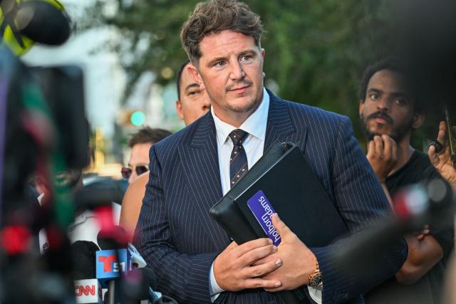 Andrew Ford, attorney for Andrew Tate and Tristan Tate, looks on after a court hearing for the brothers' extradition at the Wilkie D. Ferguson Jr. Federal Courthouse in Miami on August 27, 2026. US authorities detained the self-professed misogynist and his younger sibling on July 18, 2026 after British prosecutors announced new charges of rape, sex trafficking and assault. (Photo by GIORGIO VIERA / AFP)