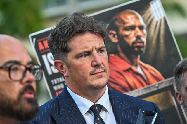 Joseph D. McBride (L), attorney for Andrew Tate and Tristan Tate, speaks to reporters, flanked by attorney Andrew Ford (C), after a court hearing for the brothers' extradition at the Wilkie D. Ferguson Jr. Federal Courthouse in Miami on August 27, 2026. US authorities detained the self-professed misogynist and his younger sibling on July 18, 2026 after British prosecutors announced new charges of rape, sex trafficking and assault. (Photo by GIORGIO VIERA / AFP)