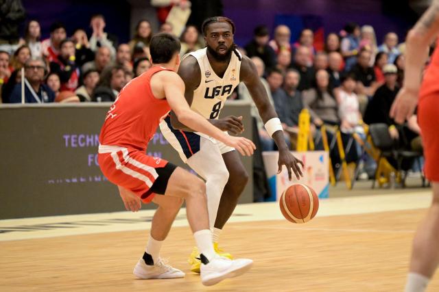 US' Kevon Harris dribbles past an opponent during the FIBA Basketball World Cup 2027 Americas qualifiers Group E match between Chile and the USA at the Centro de Deportes Colectivos stadium in Santiago on August 27, 2026. (Photo by Rodrigo ARANGUA / AFP)