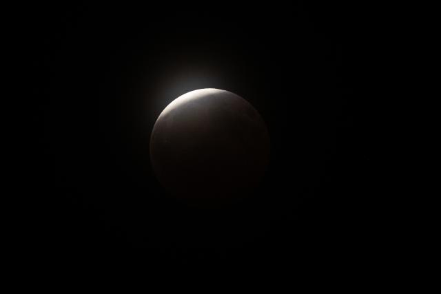 A maximum portion of the Moon is within the Earth's umbra during a partial lunar eclipse over Brazos Bend State Park in Needville, Texas on August 27, 2026. (Photo by RONALDO SCHEMIDT / AFP)