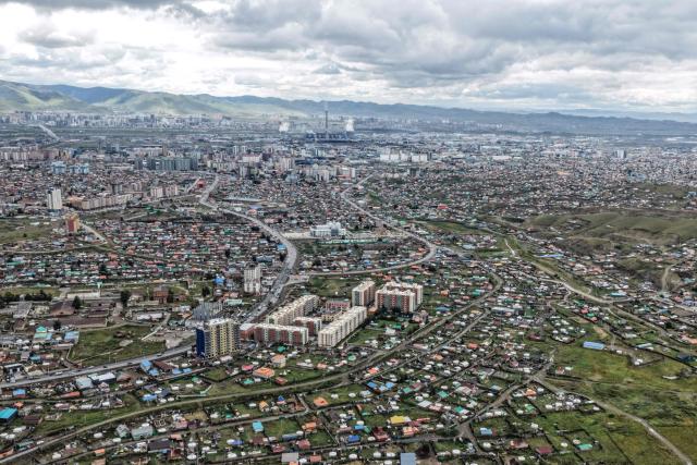 A general aerial view shows houses in Ulaanbaatar city on August 28, 2026. (Photo by Hector RETAMAL / AFP)
