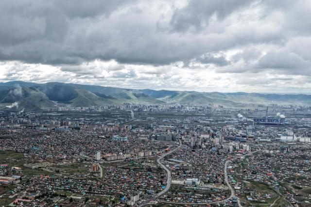 A general aerial view shows houses in Ulaanbaatar city on August 28, 2026. (Photo by Hector RETAMAL / AFP)