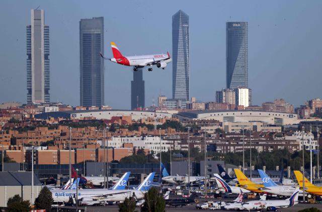 A picture taken on August 28, 2026 shows an Iberia Airbus A320 landing at Madrid's Barajas Airport. (Photo by Thomas COEX / AFP)