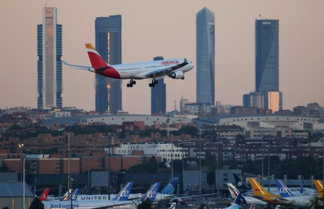A picture taken on August 28, 2026 shows an Iberia Airbus A330 landing at Madrid's Barajas Airport. (Photo by Thomas COEX / AFP)