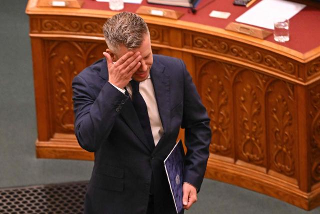 Hungarian Prime Minister Peter Magyar is seen as he steps up to the podium to address MP's prior to voting by MP's on Hungarian political scientist Anna Unger candidacy as the head of the National Asset Recovery and Asset Protection Office (NVVH) In Budapest on August 28, 2026, (Photo by Attila KISBENEDEK / AFP)