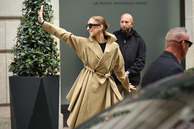 Canadian singer Celine Dion acknowledges fans as she arrives at Hotel Le Royal Monceau in Paris on August 28, 2026, ahead of her series of concerts in the French capital. Celine Dion, 58, announced in late March, in a video and a message projected onto the Eiffel Tower, her return to the stage, in Paris, after six years away from the public, between the pandemic and persistent health problems. She has suffered since 2022 from stiff person syndrome, a rare and incurable neurological condition. (Photo by SIMON WOHLFAHRT / AFP)