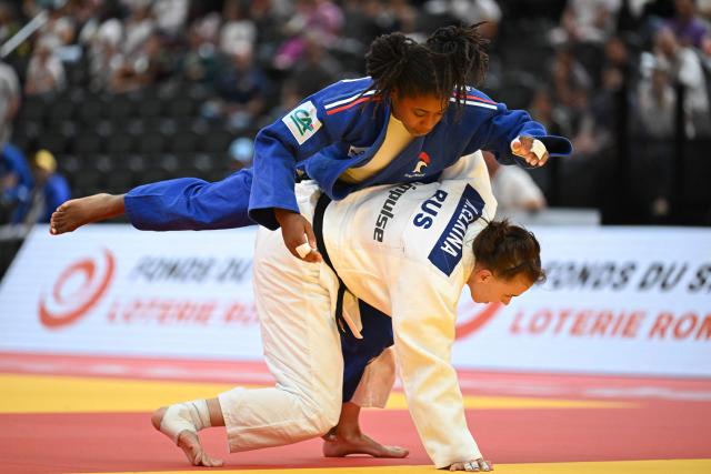 France's Sarah-Leonie Cysique (Blue) and Russia's Natalia Elkina compete in the women's under 57 kg semi final bout at the Lausanne Grand Slam judo tournament, part of the IJF World Judo Tour, in Prilly on August 28, 2026. (Photo by Fabrice COFFRINI / AFP)