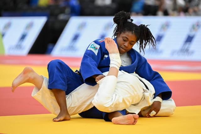 France's Sarah-Leonie Cysique (Blue) and Russia's Natalia Elkina compete in the women's under 57 kg semi final bout at the Lausanne Grand Slam judo tournament, part of the IJF World Judo Tour, in Prilly on August 28, 2026. (Photo by Fabrice COFFRINI / AFP)