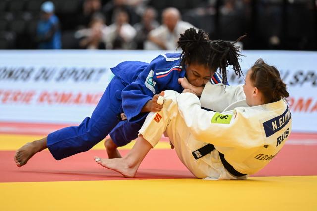 France's Sarah-Leonie Cysique (Blue) and Russia's Natalia Elkina compete in the women's under 57 kg semi final bout at the Lausanne Grand Slam judo tournament, part of the IJF World Judo Tour, in Prilly on August 28, 2026. (Photo by Fabrice COFFRINI / AFP)