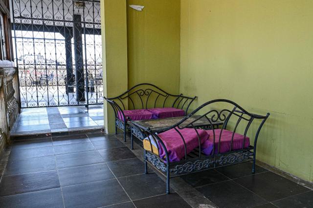 Empty dining rooms and vacant seats are seen at La Guarida, one of Cuba's best-known restaurants internationally, located in the Havana building featured in the Cuban film "Strawberry and Chocolate" ("Fresa y Chocolate"), in Havana on August 21, 2026. Opening a restaurant in today's Cuba defies all logic. Amid power outages, shortages of supplies and a sharp decline in tourism, some Cubans keep their businesses open while others even take the risk of launching new establishments. (Photo by ADALBERTO ROQUE / AFP)