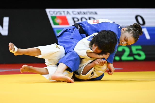 Portugal's Catarina Costa (white) and Brazil's Clarice Ribeiro compete in the women's under 48kg bronze medal bout at the Lausanne Grand Slam judo tournament, part of the IJF World Judo Tour, in Prilly on August 28, 2026. (Photo by Fabrice COFFRINI / AFP)