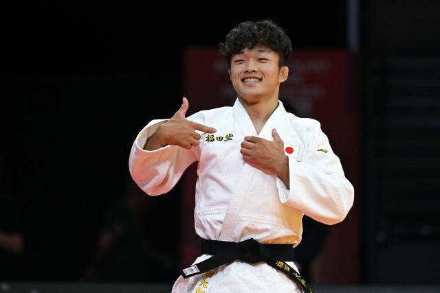 Japan's Yamato Fukuda reacts after winning the men's under 60kg gold medal bout at the Lausanne Grand Slam judo tournament, part of the IJF World Judo Tour, in Prilly on August 28, 2026. (Photo by Fabrice COFFRINI / AFP)