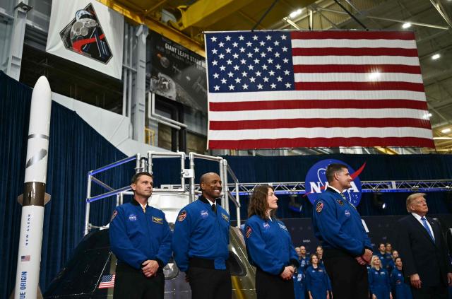 (L/R) NASA astronaut and commander Reid Wiseman, NASA astronaut and pilot Victor Glover, NASA astronaut and mission specialist Christina Koch and CSA astronaut and mission specialist Jeremy Hansen stand by US President Donald Trump during a Congressional Space Medal of Honor presentation at NASA Lyndon B. Johnson Space Center in Houston, Texas, on August 28, 2026. The Artemis II astronauts crew are honored with the Congressional Space Medal of Honor for their historic mission around the Moon. (Photo by Kent NISHIMURA / AFP)