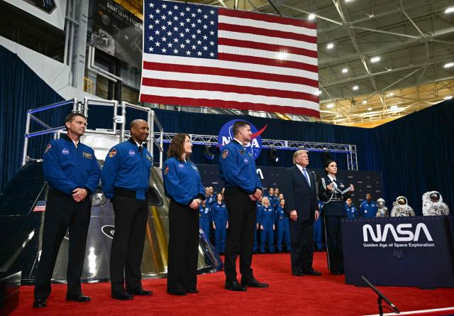 (L/R) NASA astronaut and commander Reid Wiseman, NASA astronaut and pilot Victor Glover, NASA astronaut and mission specialist Christina Koch and CSA astronaut and mission specialist Jeremy Hansen stand by US President Donald Trump during a Congressional Space Medal of Honor presentation at NASA Lyndon B. Johnson Space Center in Houston, Texas, on August 28, 2026. The Artemis II astronauts crew are honored with the Congressional Space Medal of Honor for their historic mission around the Moon. (Photo by Kent NISHIMURA / AFP)