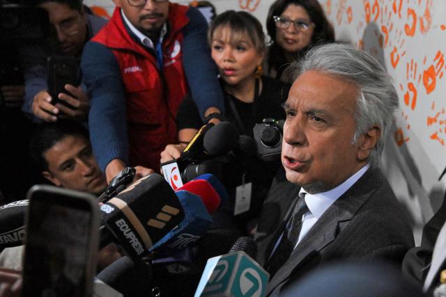 (FILES) Ecuador's former president (20172021) Lenin Moreno speaks with the media as he leaves the National Court of Justice over a corruption case in Quito, on May 11, 2026. An Ecuadoran court on August 28, 2026 convicted former leftist president Lenin Moreno of accepting millions of dollars in bribes linked to the construction of a hydroelectric plant. The Attorney General's Office said Moreno, who served as president from 2017 to 2021, was among four people convicted in the case involving a plant built by Chinese company Sinohydro during his tenure as vice president. (Photo by Rodrigo BUENDIA / AFP)