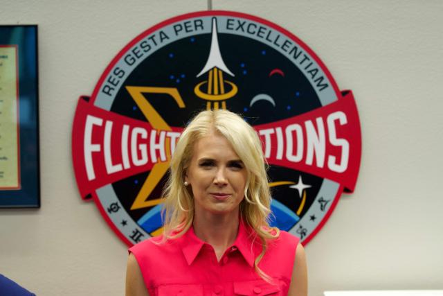 Natalie Harp, aide to US President Donald Trump, looks on as President Trump visits the Mission Control Center at NASA Lyndon B. Johnson Space Center in Houston, Texas, on August 28, 2026. During his visit, President Trump honored the Artemis II crew with the Congressional Space Medal of Honor for their historic mission around the Moon and signed an executive order that aims to create a US Space Academy. (Photo by Kent Nishimura / AFP)