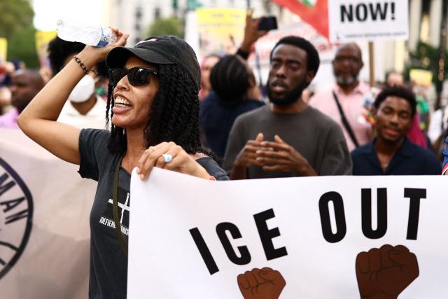 People chant slogans during a protest against the termination of Temporary Protected Status (TPS) for the Haitian community and to end mass deportations, at Foley Square in New York City on August 28, 2026. The Supreme Court said in late June 2026 that the Trump administration is allowed to end Temporary Protected Status (TPS) for Haitians and some 6,000 Syrians without judicial review, although the impact of the decision could apply to migrants from many other backgrounds. An estimated 350,000 Haitians live in the United States under the program, with many working in healthcare and construction. (Photo by CHARLY TRIBALLEAU / AFP)