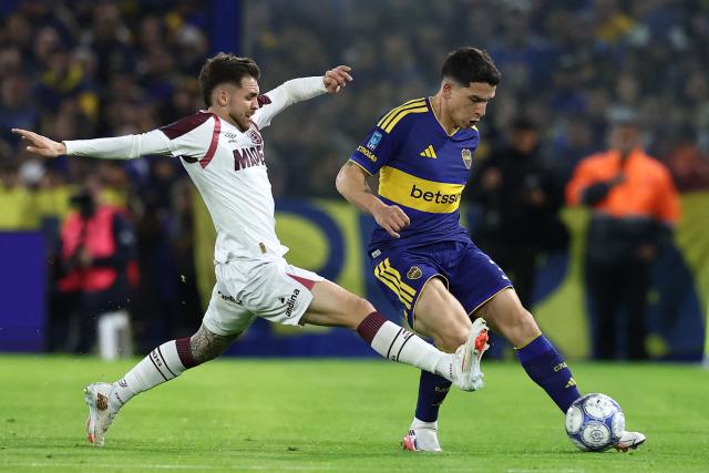 Lanus' midfielder #08 Franco Watson (L) and Boca Juniors' defender #03 Lautaro Blanco (R) fight for the ball during the Argentine Professional League 2026 Clausura tournament football match between Boca Juniors and Lanus, at La Bombonera stadium in Buenos Aires on August 28, 2026. (Photo by Alejandro PAGNI / AFP)