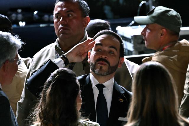 Colombia's President Abelardo De La Espriella salutes during a vigil in honor of the earthquake victims at Bolivar square in Bogota, on August 28, 2026. (Photo by Raul ARBOLEDA / AFP)