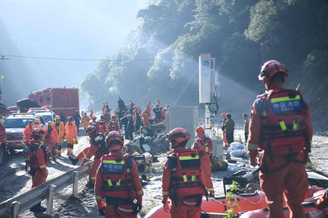 Fire and rescue personnel prepare to conduct search and rescue operations at Gyirong Port, which was damaged after a mudslide two days earlier, in Gyirong County, in China’s western Tibet region on August 28, 2026. (Photo by CNS / AFP) / China OUT