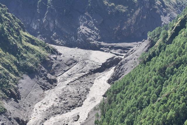 An aerial view shows the location of the destroyed Gyirong Port (C) on the border between China and Nepal, after a mudslide swept through the area two days earlier, in Gyirong County, in China’s western Tibet region on August 28, 2026. (Photo by CNS / AFP) / China OUT
