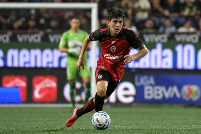 Tijuana's midfielder #10 Gilberto Mora runs with the ball during the Liga MX Apertura tournament football match between Tijuana and Pumas at the Caliente stadium in Tijuana, Baja California state, Mexico, on August 28, 2026. (Photo by Guillermo Arias / AFP)