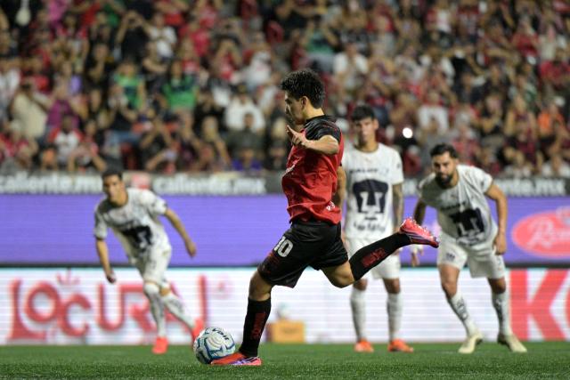 Tijuana's midfielder #10 Gilberto Mora scores his team's first goal from the penalty spot during the Liga MX Apertura tournament football match between Tijuana and Pumas at the Caliente stadium in Tijuana, Baja California state, Mexico, on August 28, 2026. (Photo by Guillermo Arias / AFP)