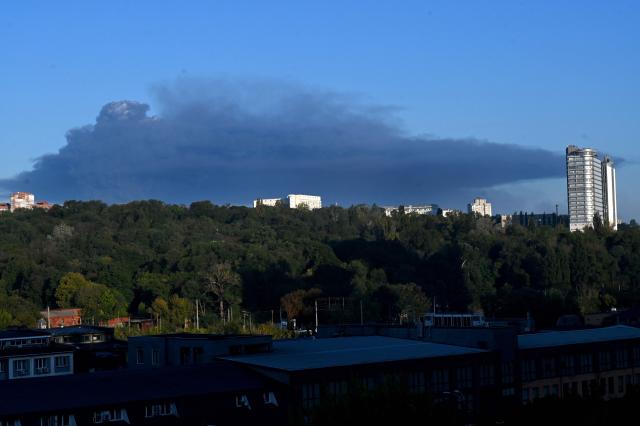 This photograph shows smoke rising following a drone strike in Kyiv on August 29, 2026, amid the Russian invasion of Ukraine. A Russian drone strike triggered a major fire and explosions at a warehouse on the outskirts of Ukraine's capital Kyiv, forcing hundreds to evacuate the region, authorities said early on August 29. (Photo by Sergei SUPINSKY / AFP)
