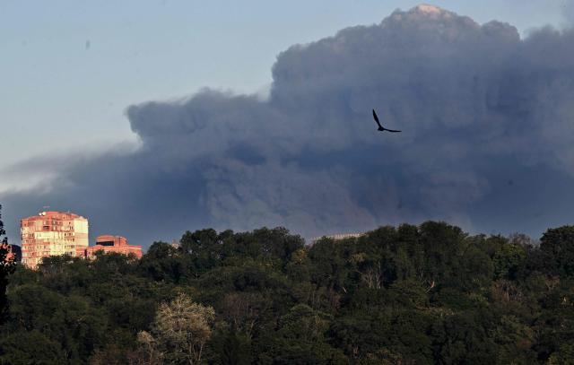 This photograph shows smoke rising following a drone strike in Kyiv on August 29, 2026, amid the Russian invasion of Ukraine, amid R. A Russian drone strike triggered a major fire and explosions at a warehouse on the outskirts of Ukraine's capital Kyiv, forcing hundreds to evacuate the region, authorities said early on August 29. (Photo by Sergei SUPINSKY / AFP)