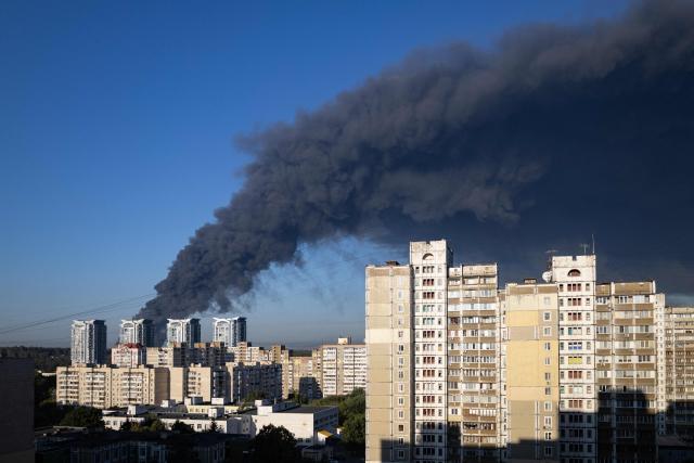 This photograph shows smoke rising following a Russian air attack in Kyiv on August 29, 2026, amid the Russian invasion of Ukraine. A Russian drone strike triggered a major fire and explosions at a warehouse on the outskirts of Ukraine's capital Kyiv, forcing hundreds to evacuate the region, authorities said early on August 29. (Photo by Serhii Okunev / AFP)