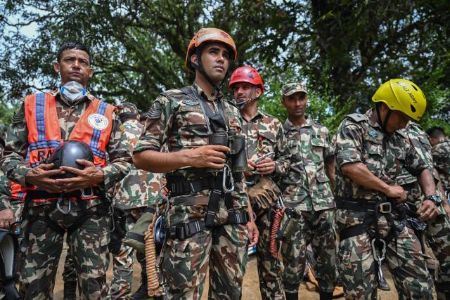 Army personnel prepare for a rescue operation in the aftermath of flash floods at Trishuli camp in Nepal's Nuwakot district on August 29, 2026. Nearly 3,000 people were still missing on August 29 and 633 confirmed dead after flash floods and landslides hit the Nepal-Tibet border. (Photo by Arun SANKAR / AFP)