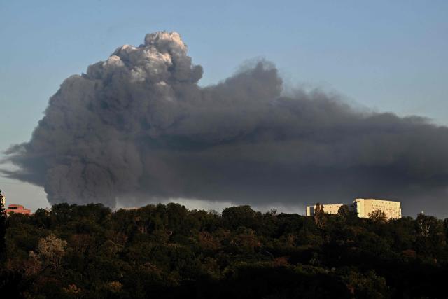 A dark smoke plume billows following a drone strike in Kyiv, on August 29, 2026, amid the Russian invasion of Ukraine. A Russian drone strike triggered a major fire and explosions at a warehouse on the outskirts of Ukraine's capital Kyiv, forcing hundreds to evacuate the region, authorities said early Saturday. (Photo by Sergei SUPINSKY / AFP)