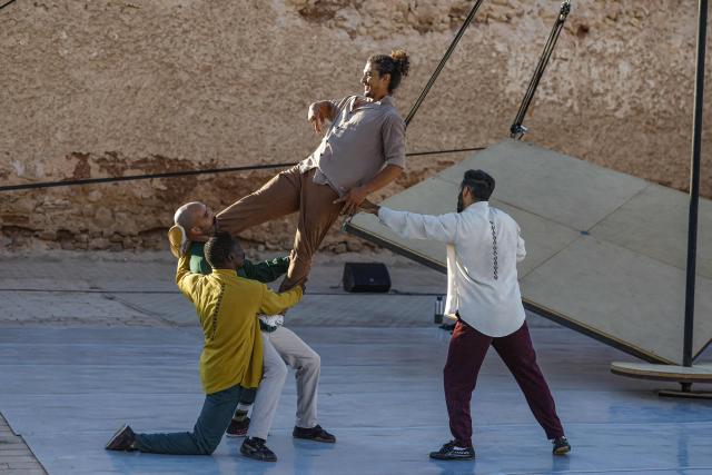 Contemporary dancers perform for the audience during the Karacena International Biennial of Circus Arts and Travel in Sale on August 28, 2026. Karacena 2026, organised by AMESIP (Moroccan Association for Assistance to Children in Vulnerable Situations) in partnership with the Shems’y National Circus School, brings together Moroccan and international artists through contemporary circus, dance, music, street arts, and equestrian arts. (Photo by Abdelmajid BZIOUAT / AFP)
