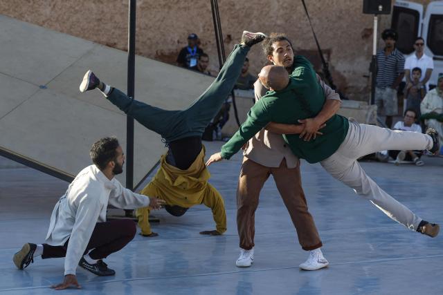 Contemporary dancers perform for the audience during the Karacena International Biennial of Circus Arts and Travel in Sale on August 28, 2026. Karacena 2026, organised by AMESIP (Moroccan Association for Assistance to Children in Vulnerable Situations) in partnership with the Shems’y National Circus School, brings together Moroccan and international artists through contemporary circus, dance, music, street arts, and equestrian arts. (Photo by Abdelmajid BZIOUAT / AFP)