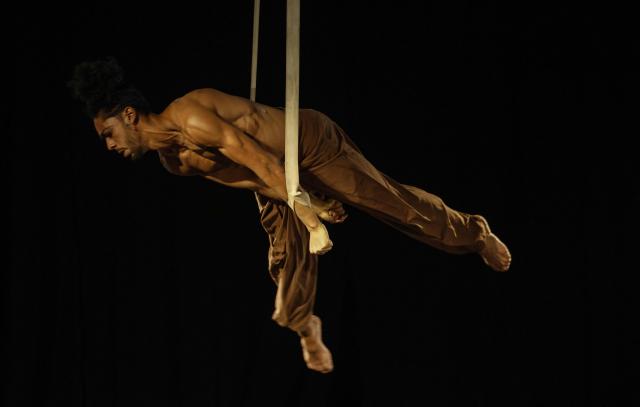 An aerialist performs for the audience during the Karacena International Biennial of Circus Arts and Travel in Sale on August 28, 2026. Karacena 2026, organised by AMESIP (Moroccan Association for Assistance to Children in Vulnerable Situations) in partnership with the Shems’y National Circus School, brings together Moroccan and international artists through contemporary circus, dance, music, street arts, and equestrian arts. (Photo by Abdelmajid BZIOUAT / AFP)