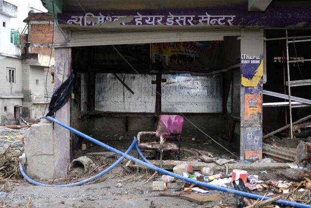 A chair covered in mud is seen at a damaged hair-dresser shop in the aftermath of flash floods at Devighat in Nepal's Nuwakot district on August 29, 2026. Nearly 3,000 people were still missing on August 29 and 633 confirmed dead after flash floods and landslides hit the Nepal-Tibet border. (Photo by Manan VATSYAYANA / AFP)