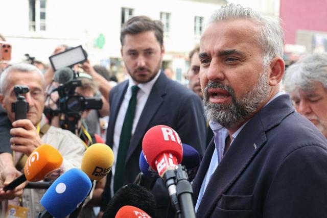 Ecologiste et Social's MP Alexis Corbiere (R) speaks to the press as he arrives for the French left-wing Socialist Party (PS) summer camp in Blois, central France on August 29, 2026. The Parti Socialiste (PS - Socialist Party) kicked off its annual summer gathering in Blois on August 28, with the planned primary of the broader left-wing socialist and democratic camp firmly in focus. For now, Place Publique leader Raphael Glucksmann is seen as the frontrunner, having secured the backing of several prominent figures, including Boris Vallaud, head of the Socialist deputies in the National Assembly. (Photo by ALAIN JOCARD / AFP)
