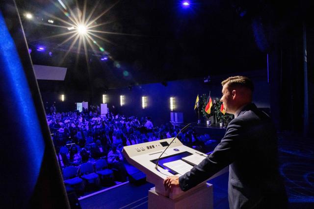 Jean-Pascal Hohm, an AfD lawmaker in the Brandenburg state parliament and chairman of Generation Germany, speaks to delegates during the federal congress of Generation Germany, the youth organization of the far-right Alternative for Germany (AfD) party, in Magdeburg, eastern Germany, on August 29, 2026. (Photo by Jens SCHLÜTER / AFP)