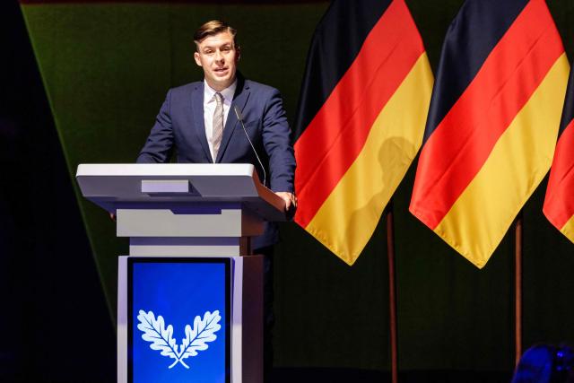 Jean-Pascal Hohm, an AfD lawmaker in the Brandenburg state parliament and chairman of Generation Germany, speaks to delegates during the federal congress of Generation Germany, the youth organization of the far-right Alternative for Germany (AfD) party, in Magdeburg, eastern Germany, on August 29, 2026. (Photo by Jens SCHLÜTER / AFP)