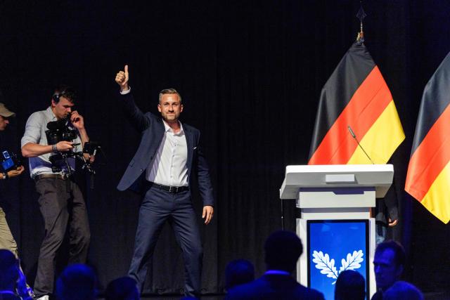 Ulrich Siegmund, far-right Alternative for Germany (AfD)'s main candidate in the Saxony-Anhalt state election, waves as he leaves the stage after addressing delegates during the federal congress of Generation Germany, the youth organization of the far-right Alternative for Germany (AfD) party, in Magdeburg, eastern Germany, on August 29, 2026. (Photo by Jens SCHLÜTER / AFP)