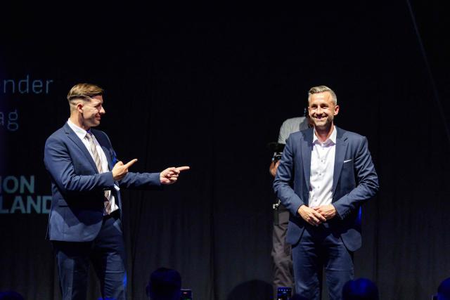 Ulrich Siegmund (R), far-right Alternative for Germany (AfD)'s main candidate in the Saxony-Anhalt state election, and Jean-Pascal Hohm (L), an AfD lawmaker in the Brandenburg state parliament and chairman of Generation Germany, are pictured during the federal congress of Generation Germany, the youth organization of the far-right Alternative for Germany (AfD) party, in Magdeburg, eastern Germany, on August 29, 2026. (Photo by Jens SCHLÜTER / AFP)